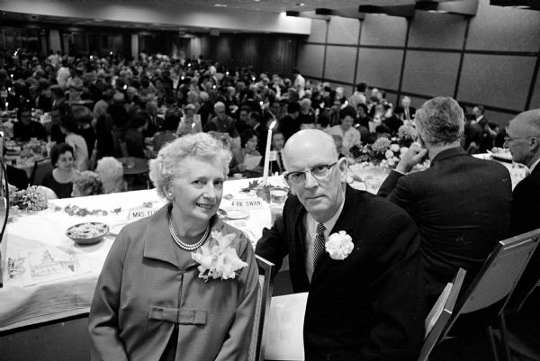 870 people gather at the Park Motor Inn banquet room to honor retiring minister Dr. Alfred Swan of the First Congregational Church. Dr. Swan began as minister of the church in 1930. Shown are his wife Eva Swan and Dr. Swan.