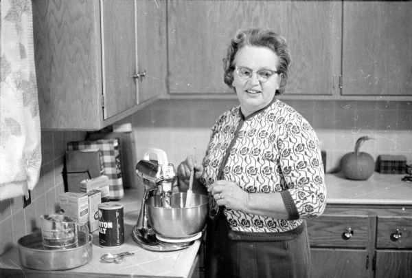 Probably a portrait of Mrs. MacLean in her kitchen, taken for the "Wisconsin State Journal" cookbook section published Oct. 17, 1965.