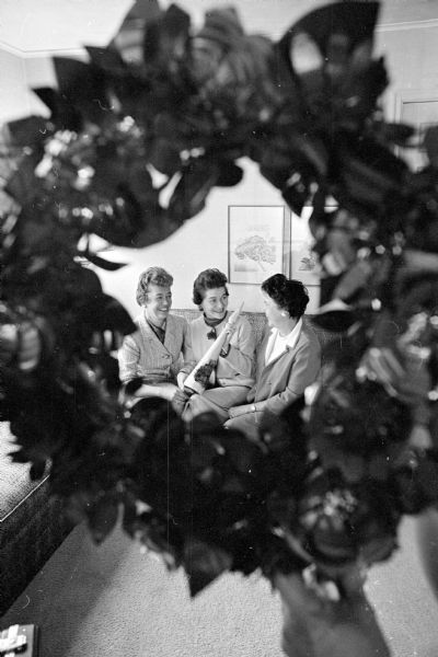 Boutique items are on display during the Christ Presbyterian Church "Home for the Holidays" tour within the church. Members of the church's service league shown (L-R) are Mrs. M.W. Kiley, 804 McBride Road; Mrs. Douglas D. Stewart, 811 Farwell Drive; and Mrs. D.A. Forberg, 33 Harbot Drive.