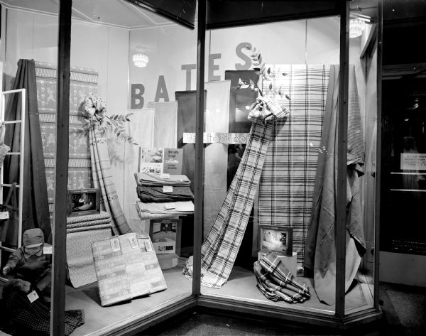 Emporium Department Store window display of Bates bedspreads and draperies with sign that reads: "Back to School."