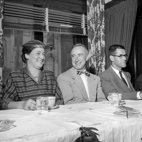 Senator Alexander's wife visiting with Wisconsin Attorney General Vernon Thomson at the luncheon. An unidentified man is on the right, but not included in the published photograph.