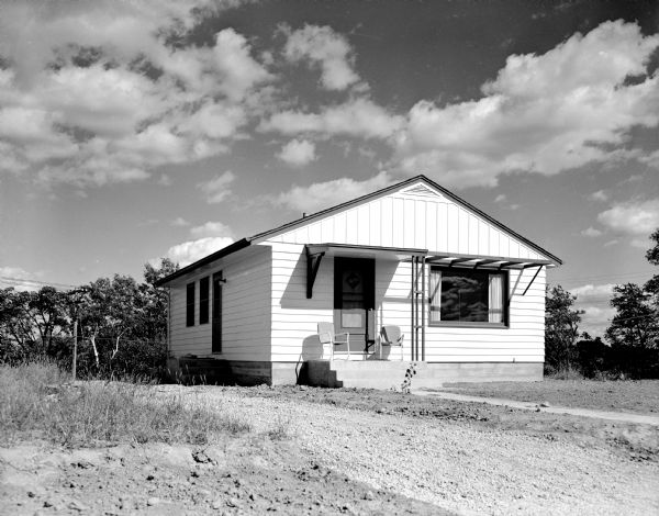 Exterior view of small house taken for Mohawk Realty Co. (location unknown).