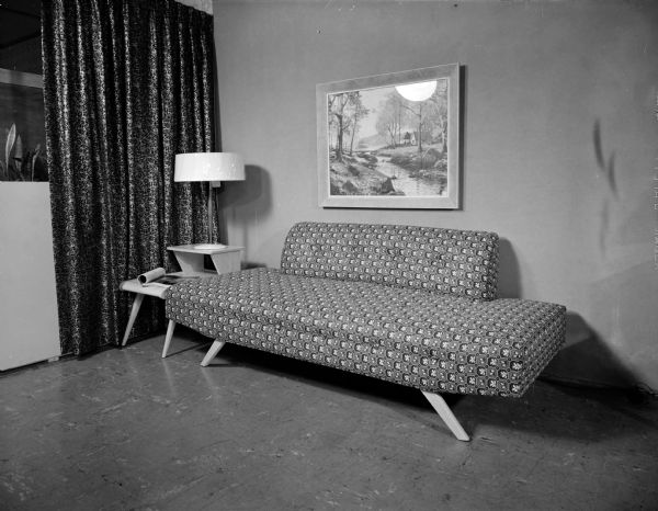 Furniture display of a sofa and lamp at the Town and Country House furniture store.