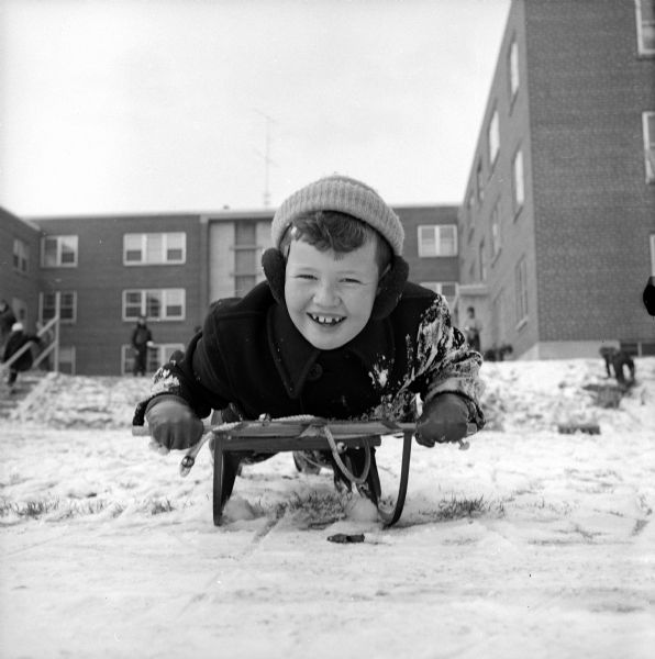 Bobby Carr enjoying a downhill run on his sled.
