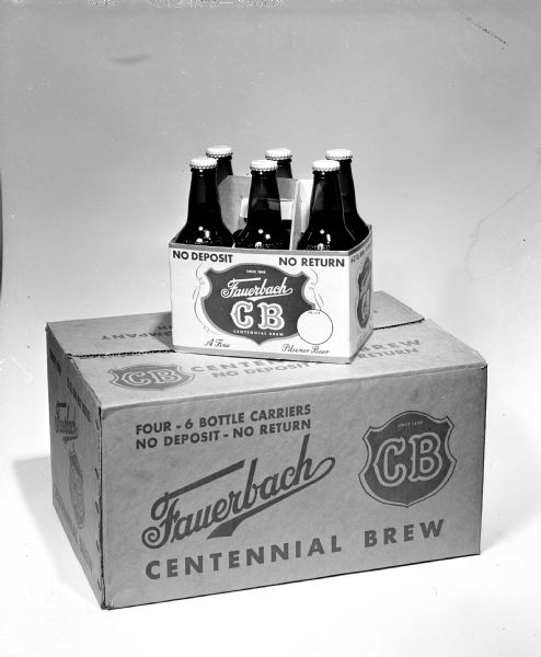 A six-pack of Fauerbach Centennial Brew bottles on top of a case of the same beer. The brand "Fauerbach CB" is seen on the packaging.