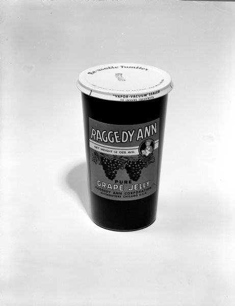 Jar of Raggedy Ann Pure Grape Jelly, sealed with a vapor-vacuum sealed lid. These jars were meant to be used as drinking glasses after the jelly had been consumed. The distributors were out of Chicago. 