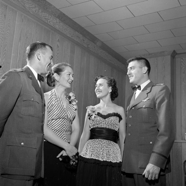 Guests at the Truax Field Officers Club formal "debt party" and dance celebrating the opening of the new clubhouse. Left to right: Lt. Col. Harry W. Shoup, commanding officer of Truax Field, Mrs. Shoup, Mrs Mejaski and Major Joseph W. Mejaski, commander of the 520th Air Base squadron.
