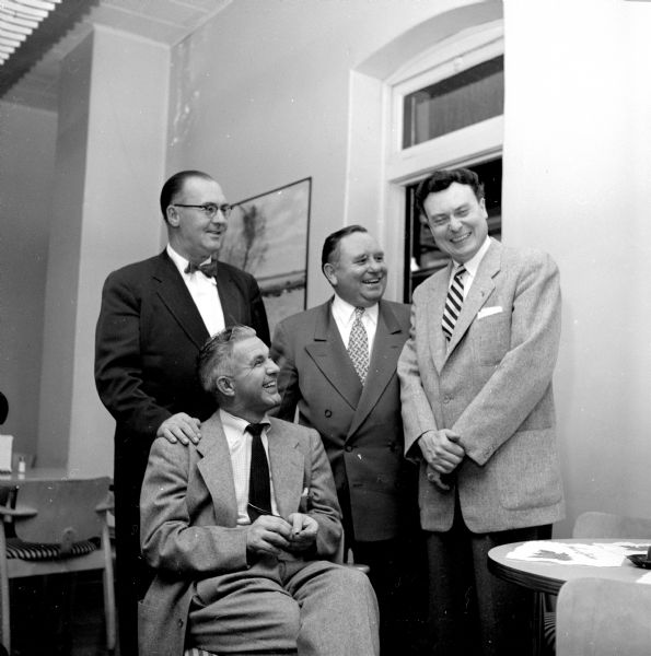 Polio campaign workers Robert Leske, R.J. Scott, Dutch Midland, and Dr. Robert B. Helrey at the kickoff banquet for the National Foundation for Infantile Paralysis.
