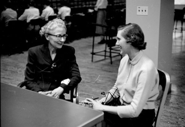 Katherine Quilliam (left), chief operator of unit No. 1 at the Madison office of the Wisconsin Telephone Company, interviews Mrs. Viola Cook for a position as operator.