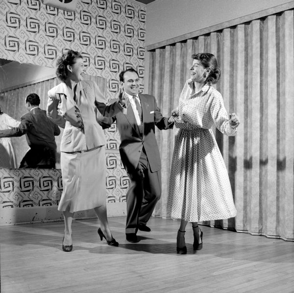 George Theiss dancing with Rose Shell (left) and Pauline Keyes at the Arthur Murray studio.