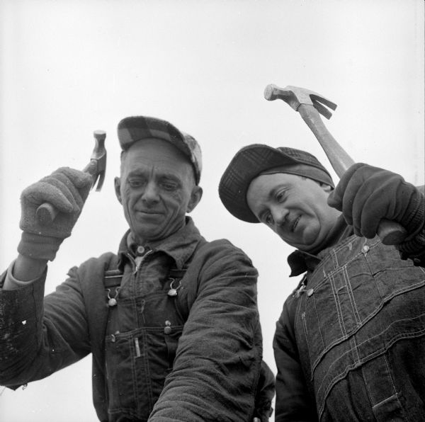Close-up of carpenters Art Thorstad and George Clark working on the new Sears Roebuck store on East Washington Avenue.
