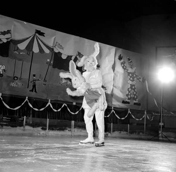 Members of the Madison Figure Skating Club held their annual winter party at the Truax Field Arena. The event was organized on a circus theme. Lona Engelberger came dressed as Harvey and carried a miniature of herself without skates.