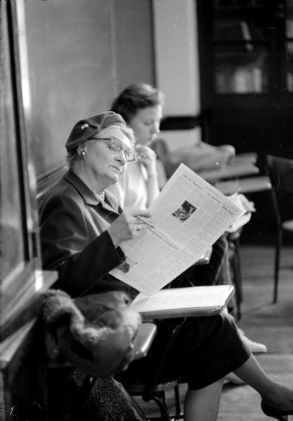 As preparation for speech class at the Madison Vocational School, Olga Toltzien is reading from <i>The American Observer</i>.