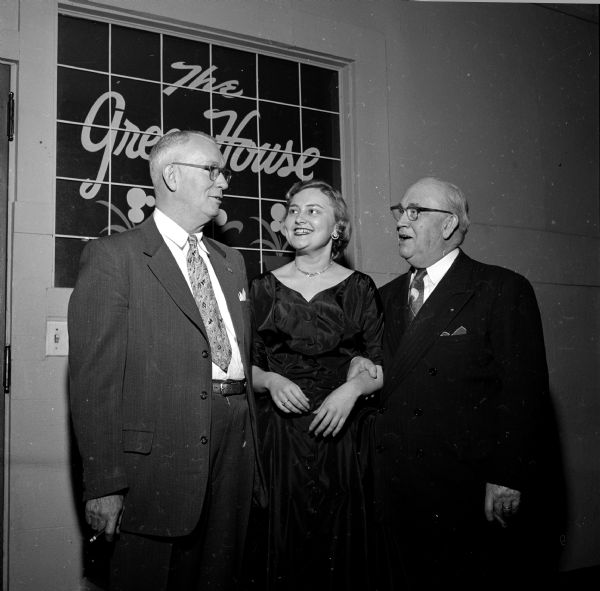 Members of the Capital City Chapter of the United Commercial Travelers Association attending a banquet at the Park Hotel. Left to right are: Anthony and Hazel Heim and B.H. Barnett.