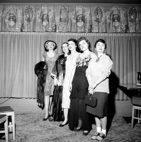 "Ads and Fads," Madison Advertising Club Women's Night, was held at the Hoffman House. Members are wearing fashions from the first half of the twentieth century. Commentary was by Mrs. Charlotte Peterson, and music was by Pat Selleger. Shown are (left to right): Luan Hoesly, Margo Eskridge, Lu Baitinger, Celeste Regenberg and Carole Hipple.   