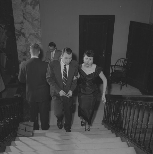 Walking up the steps toward Great Hall in Memorial Union at the ball are Kenneth Decker and Joyce Raymond.