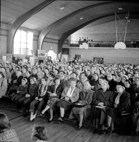 Crowd attending a Youngstown Kitchen appliances show sponsored by the Darlington Furniture Store held in the Darlington High School auditorium.