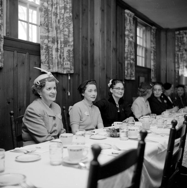 Wives of members of the Downtown Optimists Club organized an auxiliary club called the Opti-mrs. The group held their first luncheon meeting at Kennedy Manor on Langdon Street. Shown (left to right) are: Mrs. N.A. Hill (4032 Mandan Circle), Mrs. Mendez Hanson (37 Sherman Terrace), and Mrs. Jerry Coulter (416 Chamberlain Avenue).