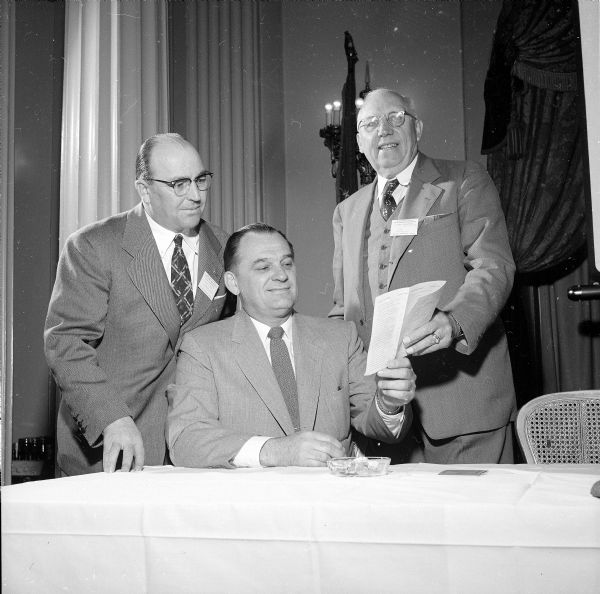 44th Annual Wisconsin Telephone Association convention held at the Hotel Loraine located at 119 West Washington Avenue. Shown are (left to right): T.H. Sanderson of Portage, Warren B. Clay of Hutchinson, Minnesota, and Madison Mayor George Forster.  