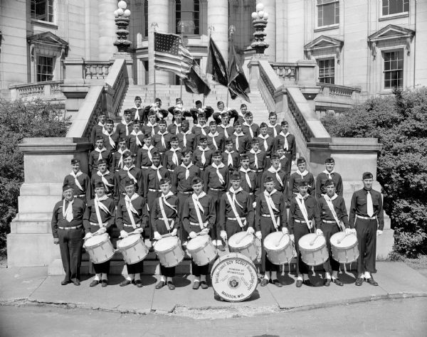 Four Lakes Drum and Bugle Corps assembled on the Capitol steps prior to their season of performances. They are made up of Boy Scouts and sponsored by the Associated Optimists Clubs of Madison.