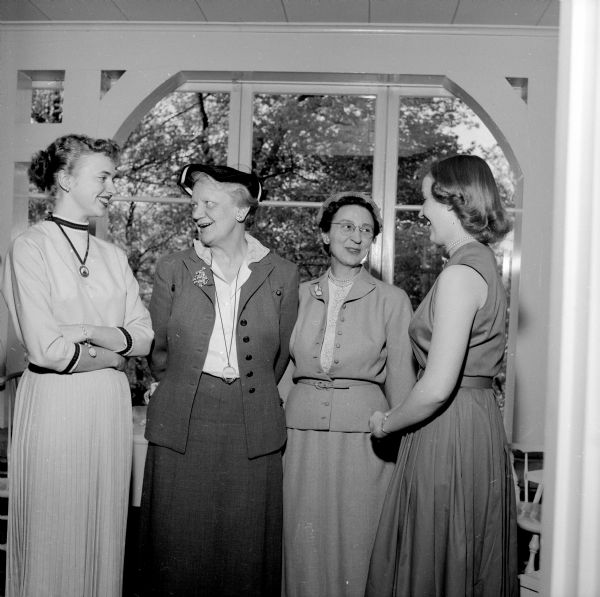 Visiting during the University of Wisconsin YWCA tea are (left to right): Elisa Splett, past president of the student YWCA council; Mrs. Ralph McCasse; Mrs. I.L. Baldwin; and Pat Cleasby.