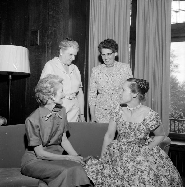 New officers of the University of Wisconsin YWCA gather at the group's tea. Shown seated (left to right) are Mrs. John Mayor, treasurer, and Mrs. John Keinitz, vice-president; and standing (left to right), Mrs. E.B. Fred, member of the board, and Mrs. Kurt Mendt, president.