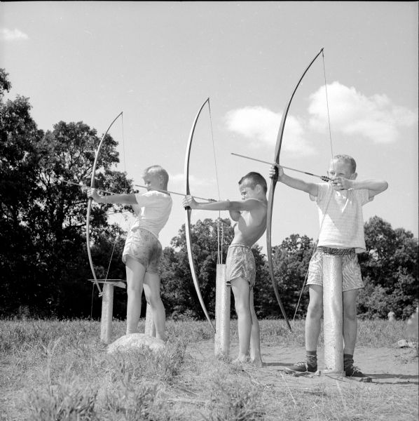 Archers John Vick, Ricky Wixson and Douglas Merdler preparing to send their arrows.