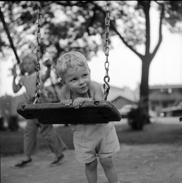 Tommy Eithum (of 754 W. Washington Avenue) is shown playing on a swing at Brittingham Park.