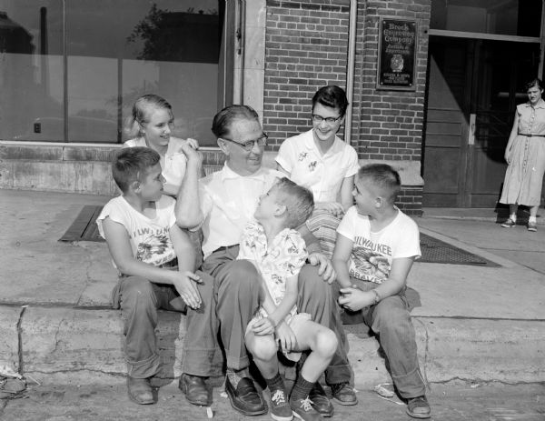 Roundy is surrounded by children who put on and participated in a neighborhood carnival fund raiser held at the Marv Wellentin home at 210 Breese Terrace. Money collected at the carnival was turned over to Roundy's Fun Fund. Pictured in the front row (left to right) are: Michael Rodenschmidt, Roundy, Charles Runkel and Billie Wellentin. In the back row are: Marijean Wellentin and Elizabeth Runkel.