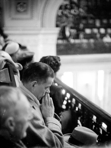 James J. Burke (of 636 Adams Street), State Revisor of Statutes, looking on from the gallery as the 1955 Wisconsin State Legislative session begins.