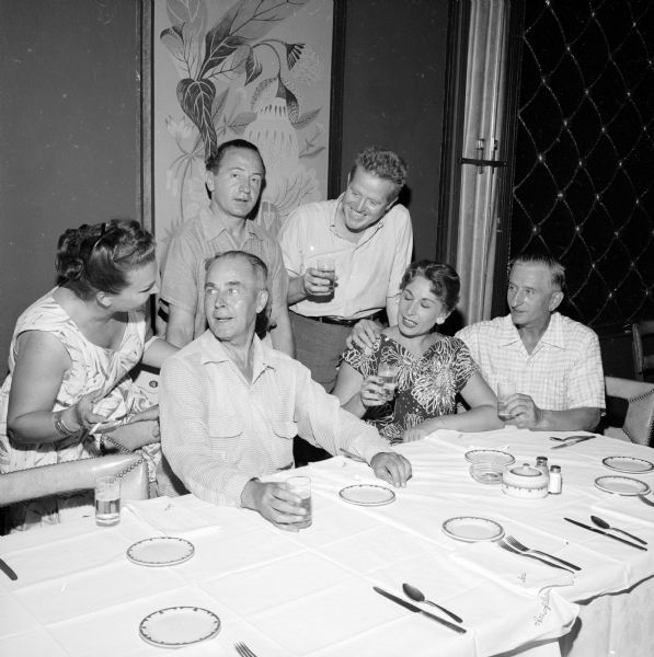 Circus performers and fans at a dinner sponsored by the Madison Wallenda Tent chapter of Circus Fans of America at the Ace of Clubs. Standing are Mr. and Mrs. Unu, who does a balancing act; and Bill Ballentine, a magazine writer. Seated are Attorney S.O. Braathen, of Waubesa Beach; Gena Lipowske, a circus dancer; and her husband Charles Moroski, a center stage performer with a trained horse act.