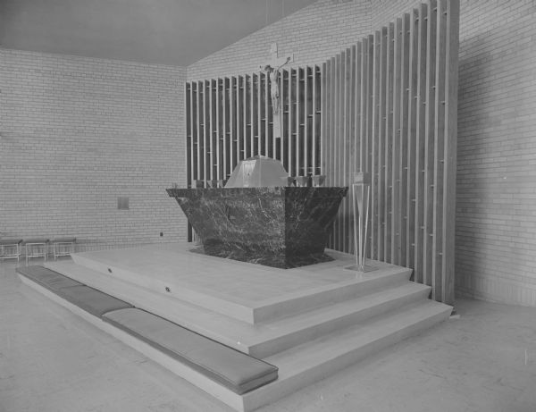 Interior view of the altar and tabernacle in the contemporary sanctuary of the new Our Lady Queen of Peace Catholic Church at 401 South Owen Drive.