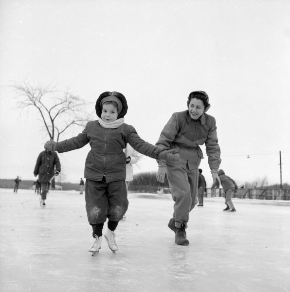 Stella Gelman helping her daughter, Cindy, ice skate on frozen parts of Lake Wingra at Vilas Park.
