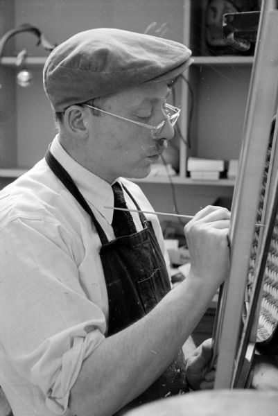 University of Wisconsin artist-in-residence, Aaron Bohrod, at work in his campus studio. Bohrod started the position in 1948.