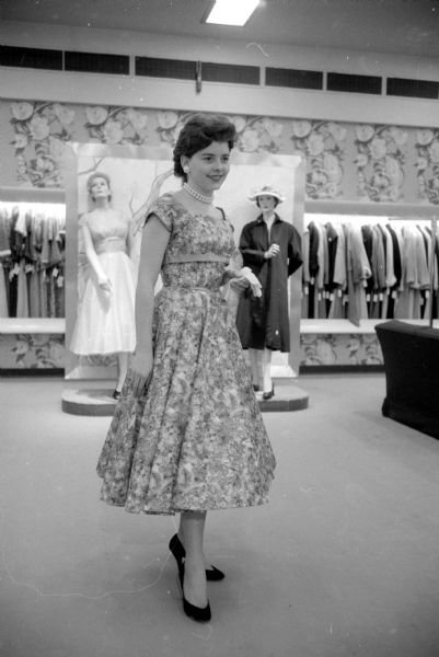 Teenage fashion show held at Harry S. Manchester women's clothing store to display twenty Vogue Pattern Service dress pattern styles. One of the models is Alice Dean (909 Lincoln Street), a junior at West High School.   