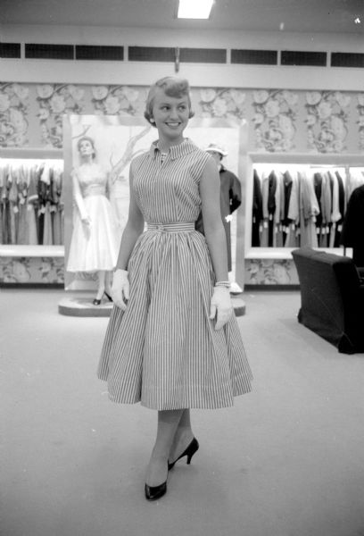 Teenage fashion show held at Harry S. Manchester women's clothing store to display twenty Vogue Pattern Service dress pattern styles. One of the models is Lois Kalscheur (813 Terry Place), a senior at Edgewood High School. 