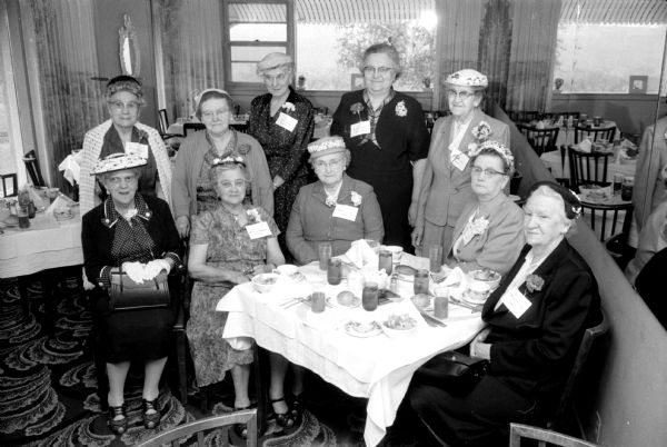 Annual Wisconsin State Journal correspondents' conference held at the Nob Hill Supper Club. Shown are some of the long-time area correspondents. Seated left to right are: Grace Marsh (of Brodhead); Mrs. William Hammermeister (of Rock Springs); Mrs. Arthur Paulson (of Oregon); Mrs. A.W. Pickering (of Black Earth); and Mrs. Henry Fillbach (of Cobb). Standing left to right are: Mrs. George Noyes (of Evansville); Mrs. Lubin Short (of Linden); Lillian Gorder (of Richland Center); Mrs. Aleda Banta (of Soldiers Grove); and Mrs. Frank L. Doudna (of Poynette).