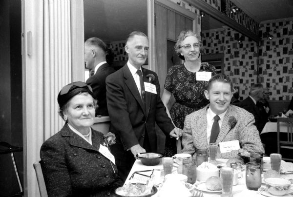 Annual Wisconsin State Journal correspondents' conference held at the Nob Hill Supper Club. Shown attending the gathering are (left to right): Mrs. John Gerhardt, Lyndon Station correspondent; Harold E. McClelland, State Editor; Mrs. Earl Gest, Deforest correspondent; and James Warner Jr., Janesville correspondent. They are each wearing carnations.