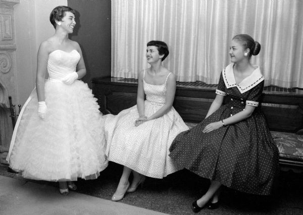 Three Gamma Phi Beta undergraduates who will serve as models at the annual spring fashion tea. The co-eds, dressed in formal dresses, are left to right: Jacquelyn Heal (of Shawano); Marlowe Petrie (of Chicago); and Patricia Regan(of Providence Rhode Island).