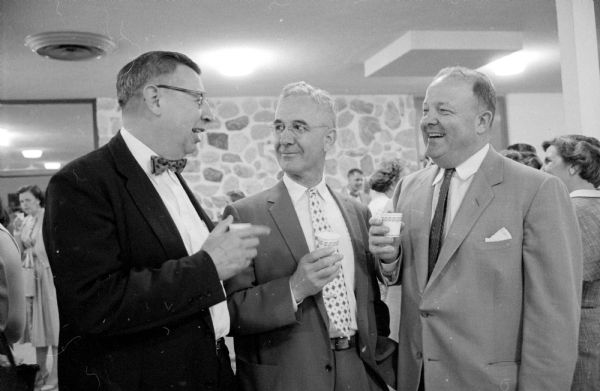 Three attendees at the retirement party for retiring general secretary of the Madison YMCA, Loren Cockrell, at Camp Wakanda. From left are H. F. Brandenburg, E.A. Gaumnitz, and Ellis H. Dana. 