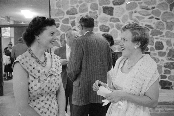 Velma Geraldson (left) and her neighbor Lois Wille were in attendance at the retirement party for retiring general secretary of the Madison YMCA, Loren Cockrell, at Camp Wacanda. Velma's husband, David, is vice-president of the Y Men's Club.