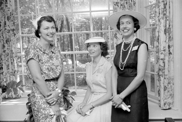 Members of the PEO (Philanthropic Educational Organization) Sisterhood Reciprocity Board honor First Lady Helen (Davis) Thomson, wife of Wisconsin Governor Vernon W. Thomson, and Mrs. A. E. Hatch (Fond du Lac), State PEO president, at a tea held at the Maple Bluff home of Marilyn Anderson (husband Don, 801 Magdeline Drive), wife of the <i>Wisconsin State Journal</i> publisher. Left to right are: Jean Rennebohm (husband Robert, 457 Charles Lane); Mrs. John Ross (University Houses); and Jeanne Lee Kiley (husband Maurice, 804 McBride Road).    