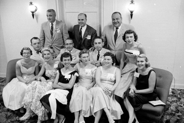Members of the Madison West High School Class of 1942 at their reunion at the Park Hotel. Pictured in the first row are: Jane Stolper, Jeanne Noth, Jeanne Kiley, Lois Bjerk, Elaine Grady, and Marilyn Woolley. In the second row are: Robert C. O'Malley, Jr., Kenneth Grady, Robert Dunn, and Betty Wiltgen. In the third row are: Carter Wiltgen, Joseph C. Fagan, and Charles Borsuk.
