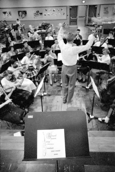 Conductor Walter Heermann leading the Madison Civic Symphony orchestra of 75 members during a rehearsal at Scanlan Hall. The group rehearsed every Tuesday night. 
