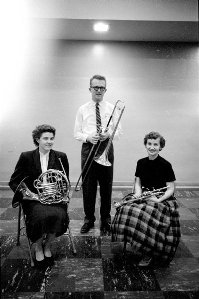 The principal players of the brass section of the Madison Civic Symphony orchestra at rehearsal in Scanlan Hall. From left are: Nancy Becknell, French horn; James Christensen, trombone; and Fern Kirkpatrick, trumpet.