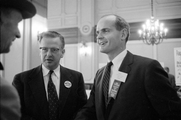 State Assemblyman Carl Thompson of Stoughton, and U.S. Senator William Proxmire talk at the Democratic State Convention held at the Hotel Loraine. Thompson is the former State Democratic Party Chairman, national committeeman and one-time candidate for governor. Proxmire is the first Wisconsin Democrat elected to the U.S. Senate in 25 years.    