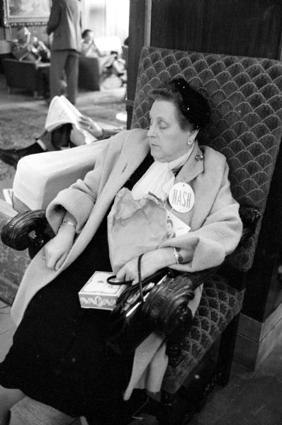 An unidentified delegate  in support of Philleo Nash taking a catnap during the Democratic Party State Convention at Hotel Loraine.