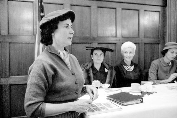 Arabel Murphy makes a committee report at the meeting of the Republican Women's Club. Looking on are Elizabeth Roby and Lynn Honeck, wife of the Wisconsin Attorney General.