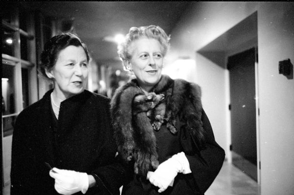 Mrs. (Helen) Walter E. Meanwell and Mrs. Edward J. Young attending the opera "Traviata" at the Memorial Union Theater. They are wearing white gloves for the occasion.