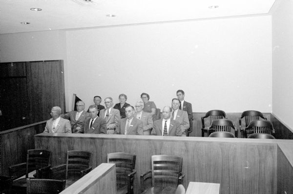 Group portrait of the jurors in the jury box. These men and women served jury duty for the murder trial of Ralph O'Dell, accused of shooting Joseph Knock during a burglary attempt.